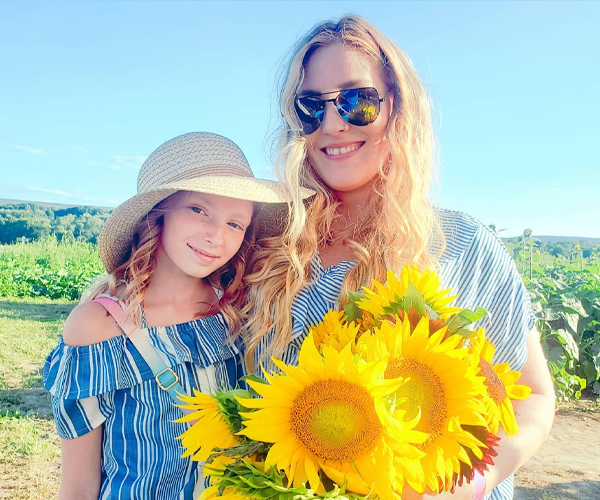 mom & daughter picking flowers